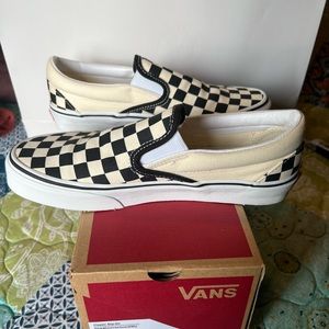 Black white checkered slip on vans